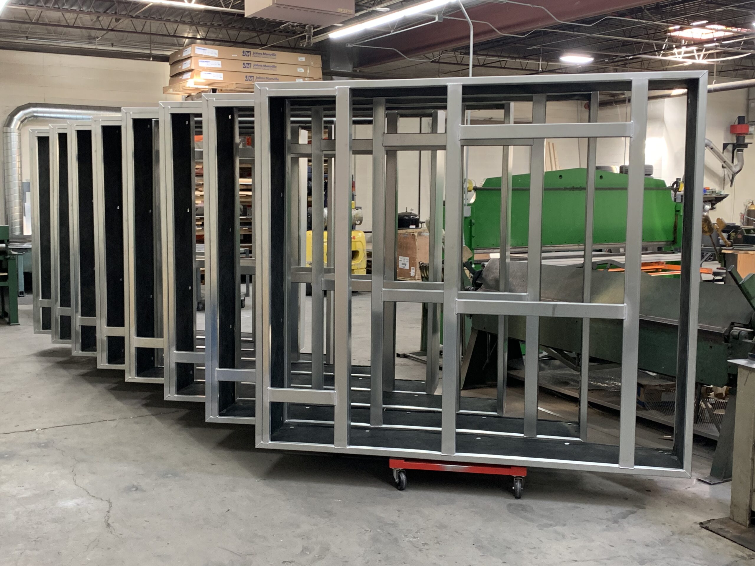 Welded metal roof curbs