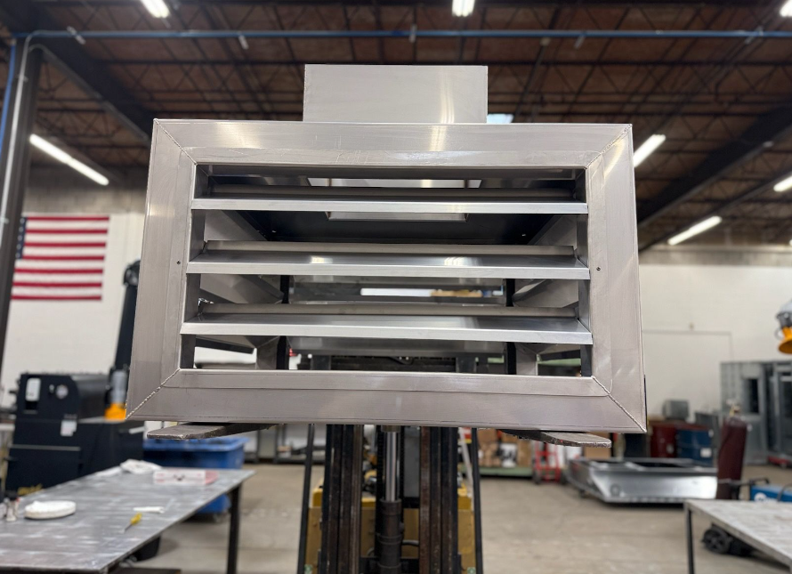 stainless steel drum diffuser with adjustable blades and a 2” drain connection with crossbrake in the bottom.